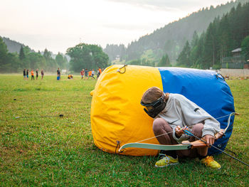 People relaxing on field