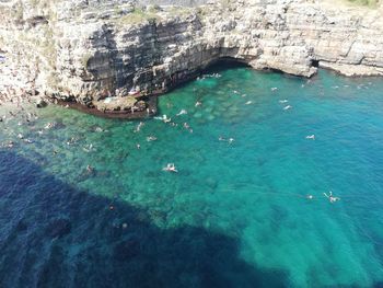 High angle view of rocks in sea