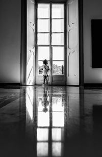 Reflection of child on glass window