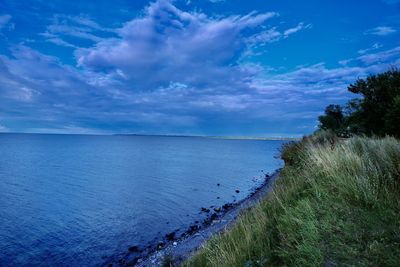 Scenic view of sea against blue sky