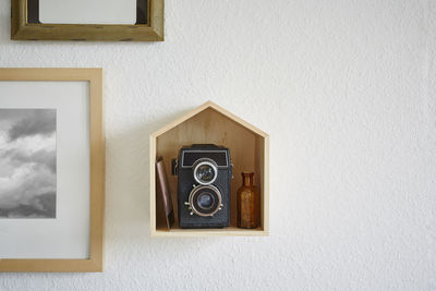 Close-up of camera on window at home