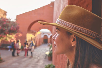 Side view of young woman looking away