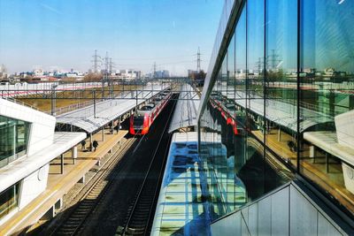 High angle view of railroad tracks in city against sky