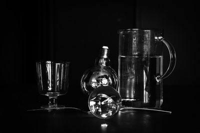 Close-up of wine glasses on table