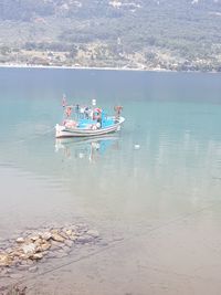 People in boat at sea