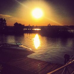 Scenic view of lake at sunset