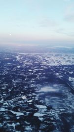 Scenic view of snow covered landscape against sky