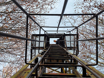 Low angle view of man standing on staircase