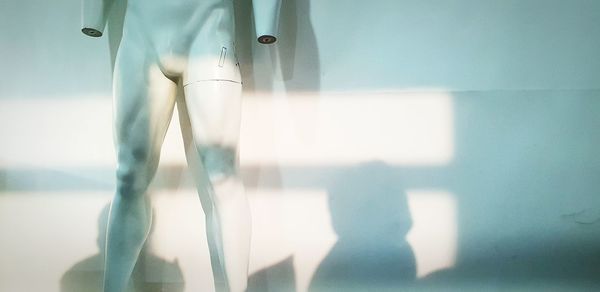 Mannequin against white wall in store