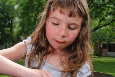 Close-up of cute girl outdoors