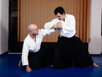 Men fighting on tatami mat