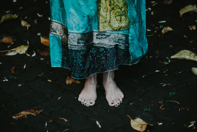 Low section of woman standing on floor
