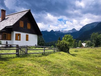 House on field against sky