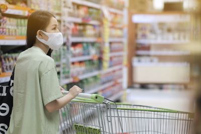 Full length of man standing at store