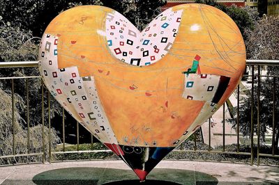 Close-up of multi colored heart shape on metal