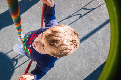 High angle view of boy playing in playground