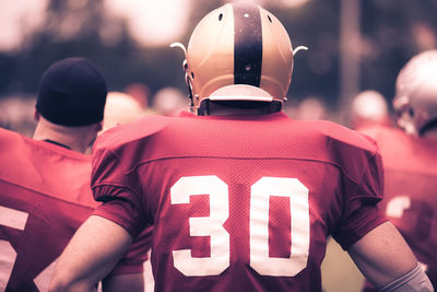 Rear view of sportsman wearing uniform