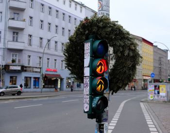 Close-up of road sign on city street