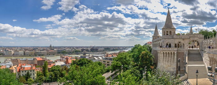 Panoramic view of the danube river and parliament building in budapest, hungary, on a summer day