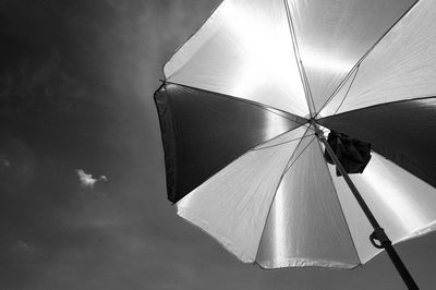 Low angle view of umbrella against sky