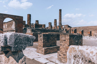 Old ruins of temple against cloudy sky