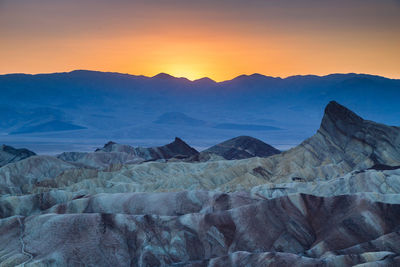 Scenic view of dramatic landscape during sunset