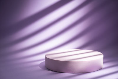 Close-up of round object over purple background