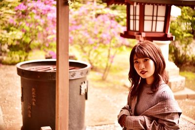 Portrait of young woman at shrine 