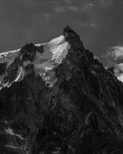 Low angle view of rock formation against sky