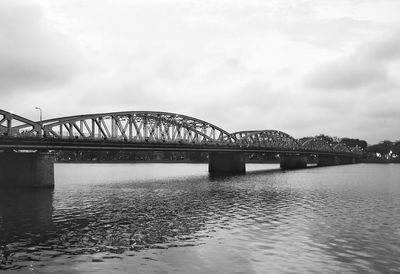 Bridge over river against sky