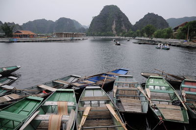 Boats moored at lake