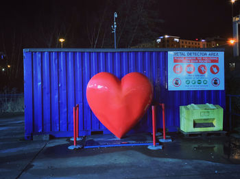 Heart shape on illuminated street at night