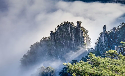 Low angle view of waterfall against sky