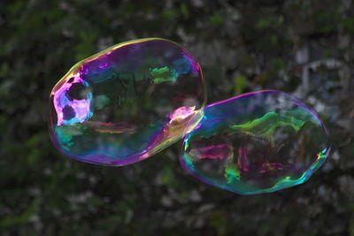 Close-up of bubbles in mid-air against wall