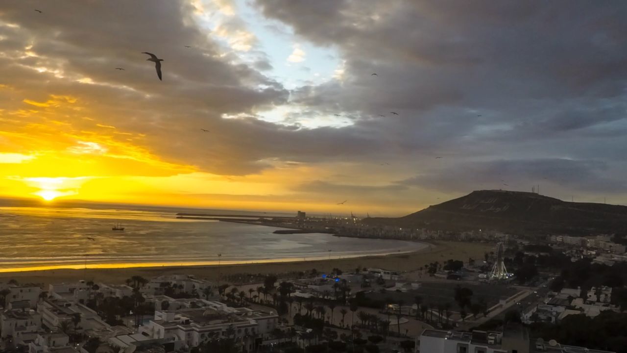 sunset, sky, cloud - sky, nature, sea, water, beauty in nature, scenics, outdoors, no people, bird, architecture, animal themes, city, day