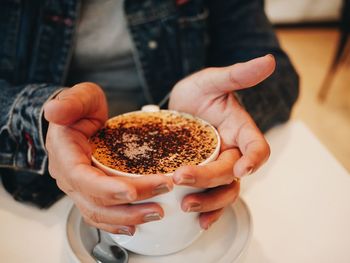 Close-up of hand holding coffee