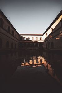 Reflection of building in water at night