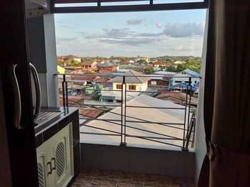 Buildings and houses seen through glass window