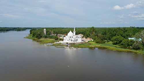 Church by building against sky