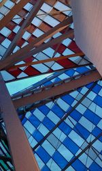 Low angle view of modern building against blue sky