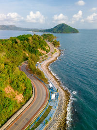 High angle view of road by sea against sky