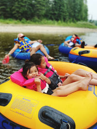 Rear view of woman in boat