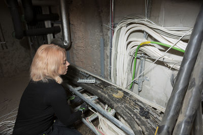 Female electrician at work