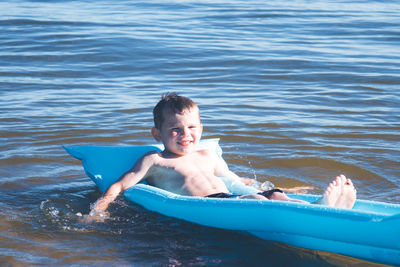 Portrait of smiling boy in water