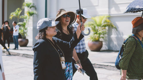 People in traditional clothing standing outdoors