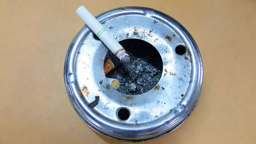 High angle view of cigarette on table