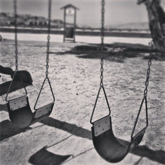 focus on foreground, transportation, metal, close-up, outdoors, day, mode of transport, water, absence, no people, swing, protection, nautical vessel, selective focus, empty, playground, nature, river, sunlight, rope