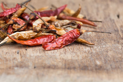 Close-up of dried meat on dry leaves on table