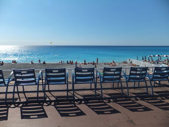 Scenic view of beach against blue sky