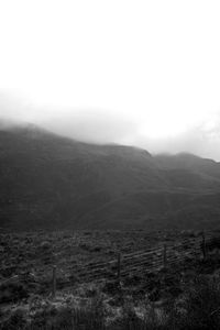 Scenic view of landscape and mountains against sky